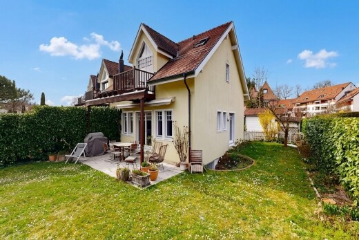 outdoor house with a patio area, a fenced backyard, and stucco siding