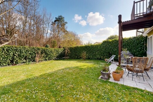 garden with a fenced backyard and a patio area