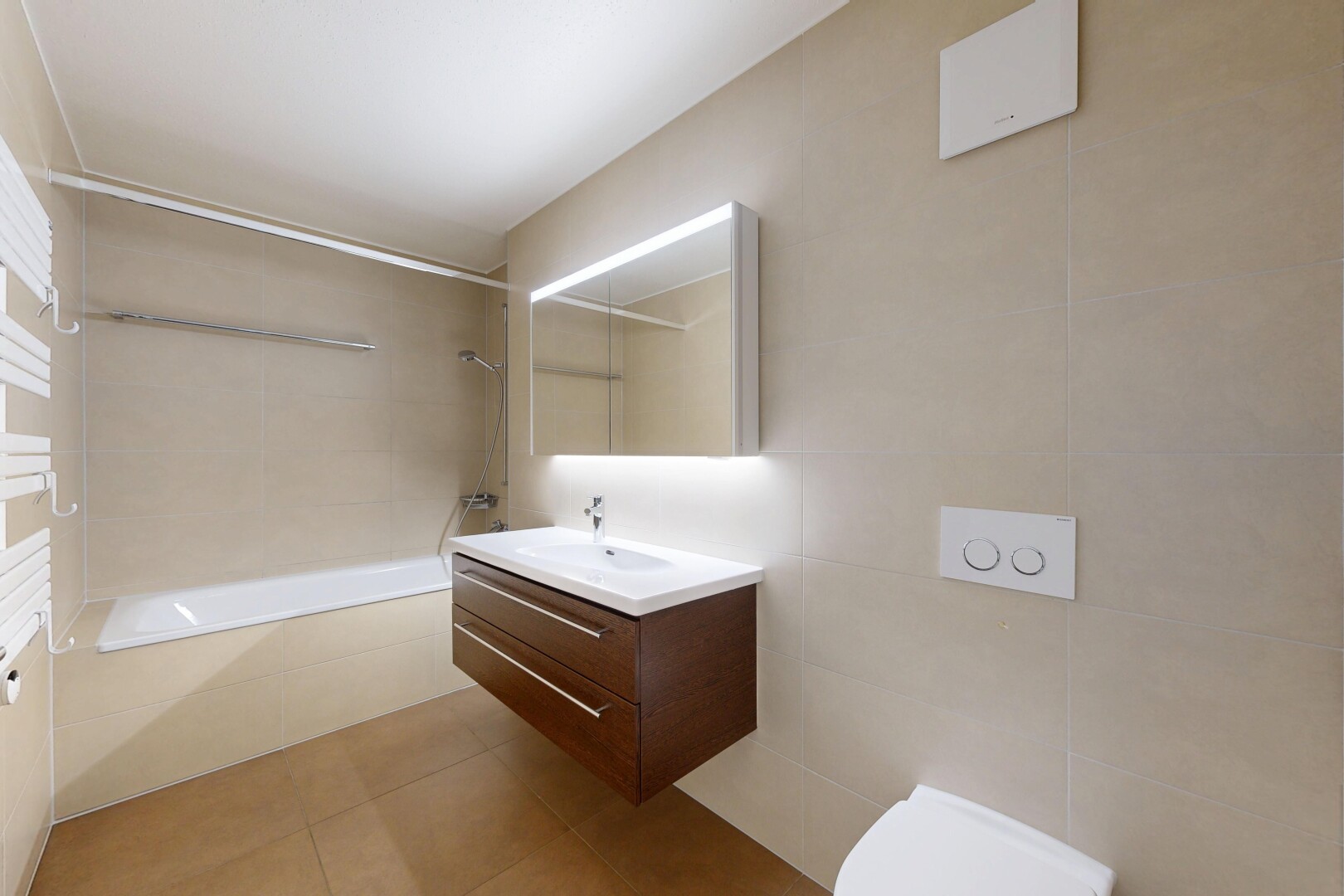 full bathroom with tile walls, vanity, light tile patterned flooring, and tiled shower / bath combo