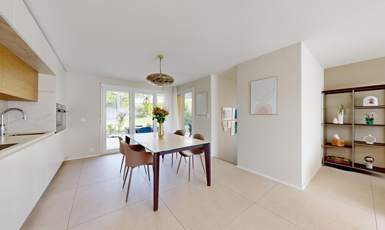 dining space with baseboards and light tile patterned flooring