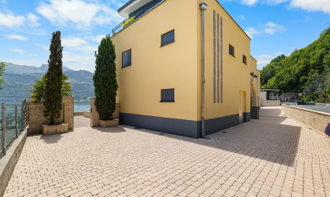 view of home with stucco siding and a mountain view
