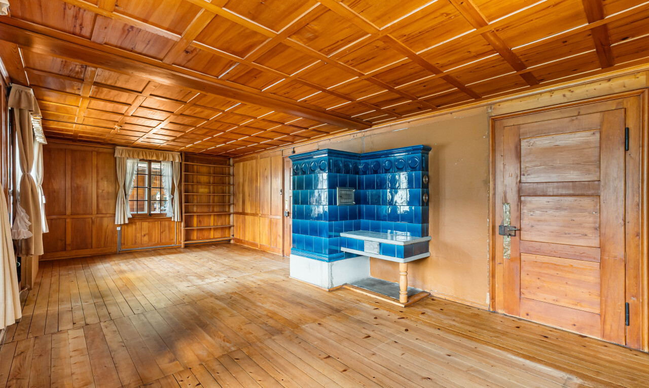 unfurnished room with wooden ceiling, light wood-style floors, and wooden walls