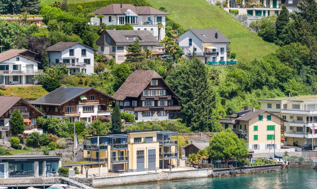 view of home featuring a residential view and a water view