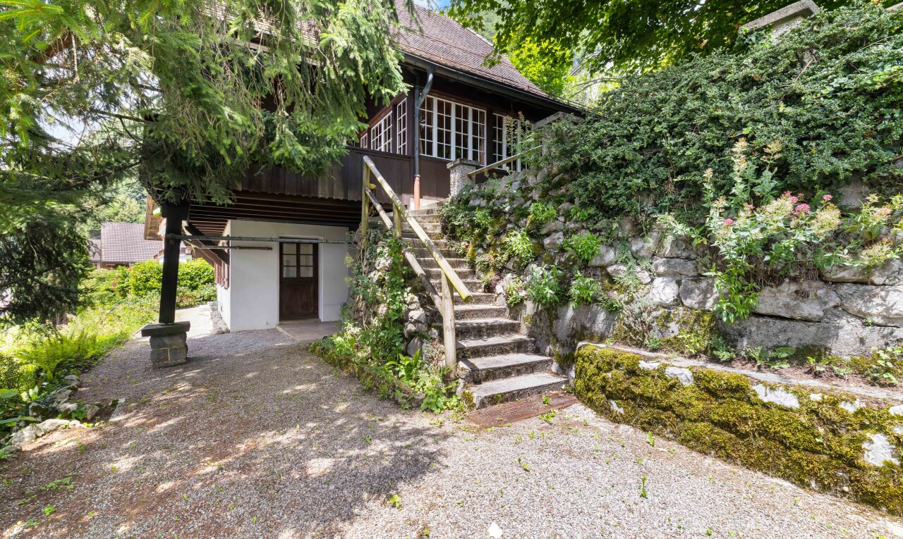 view of home featuring stairs