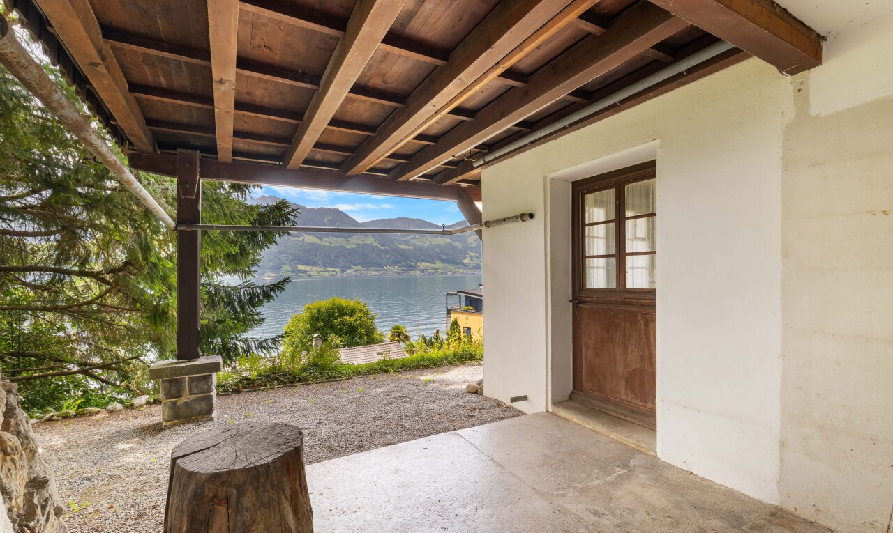terrace with a water view and a patio area