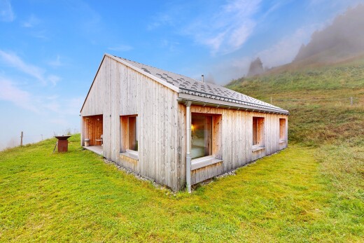 view of property featuring an outbuilding and a yard