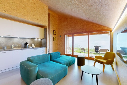 wohnzimmer mit finished concrete floor, inside property, vaulted ceiling, dachschräge, und concrete floor