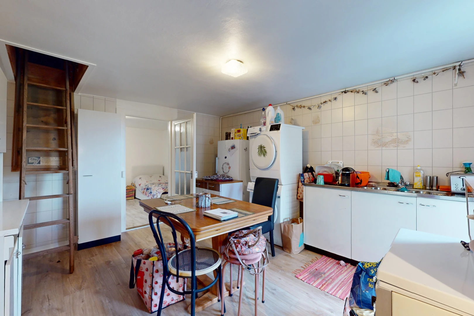 kitchen featuring white cabinets, tile walls, light hardwood / wood-style floors, and white fridge