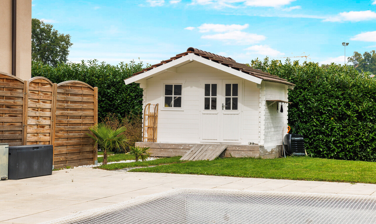 view of home with an outdoor structure