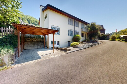 außenansicht mit pergola, stuckverkleidung, terrasse, property visible, und day time