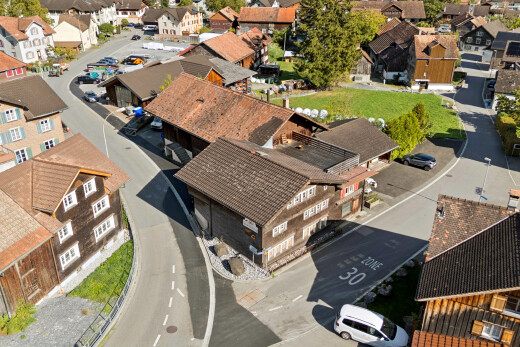 view of home with a residential view and curbs