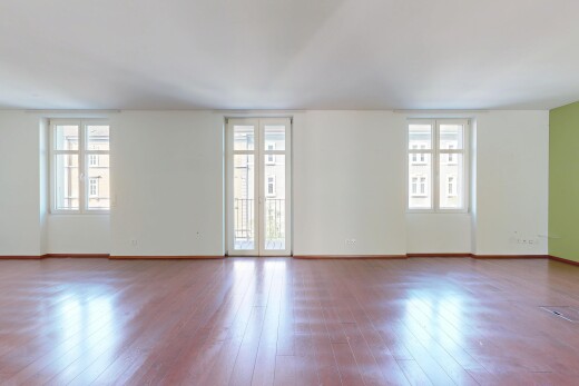 empty room featuring plenty of natural light and wood-type flooring