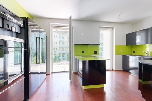 kitchen featuring light countertops, stainless steel appliances, dark wood-style flooring, and modern cabinets