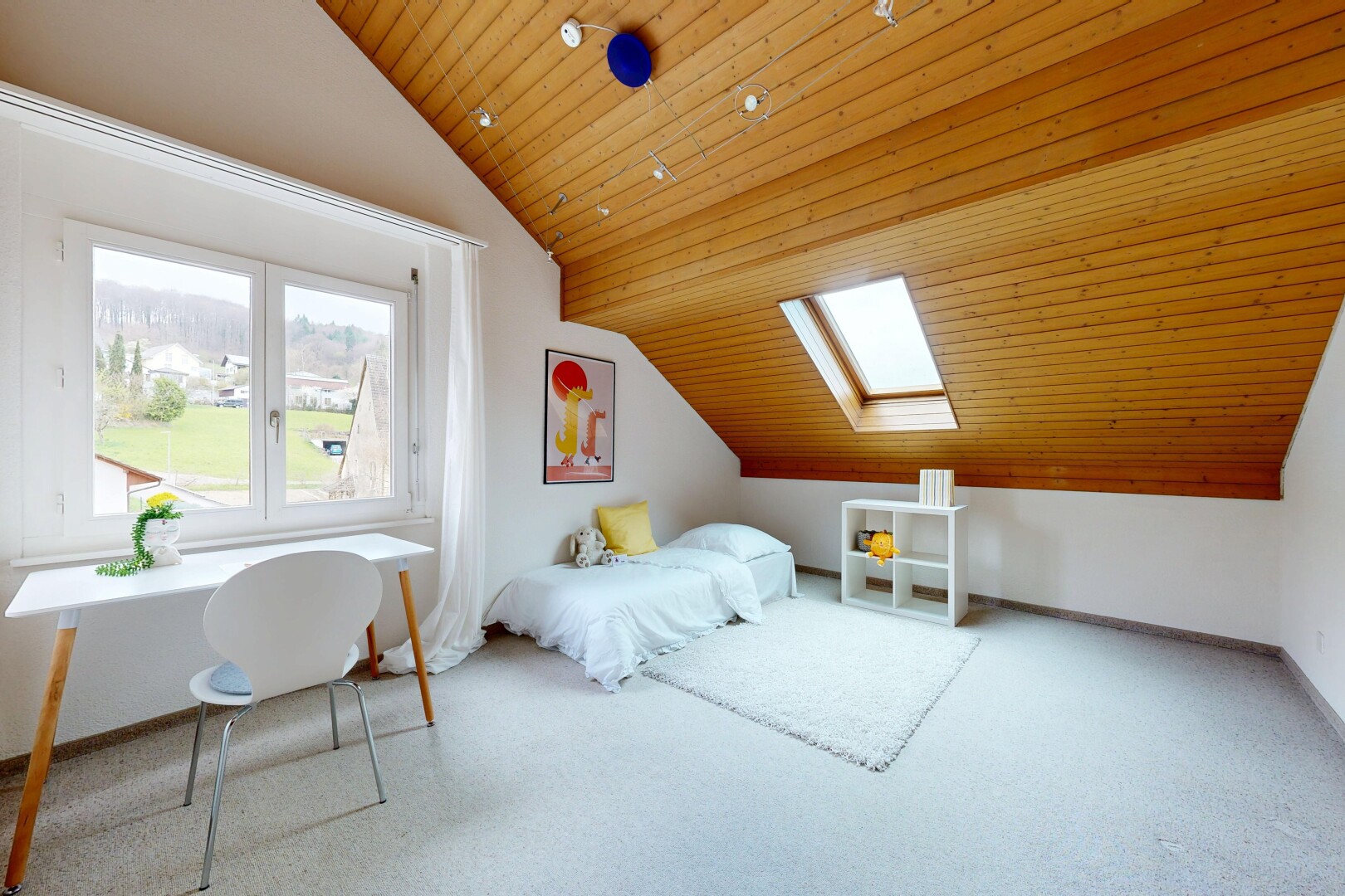 carpeted room featuring a vaulted wooden ceiling and a skylight