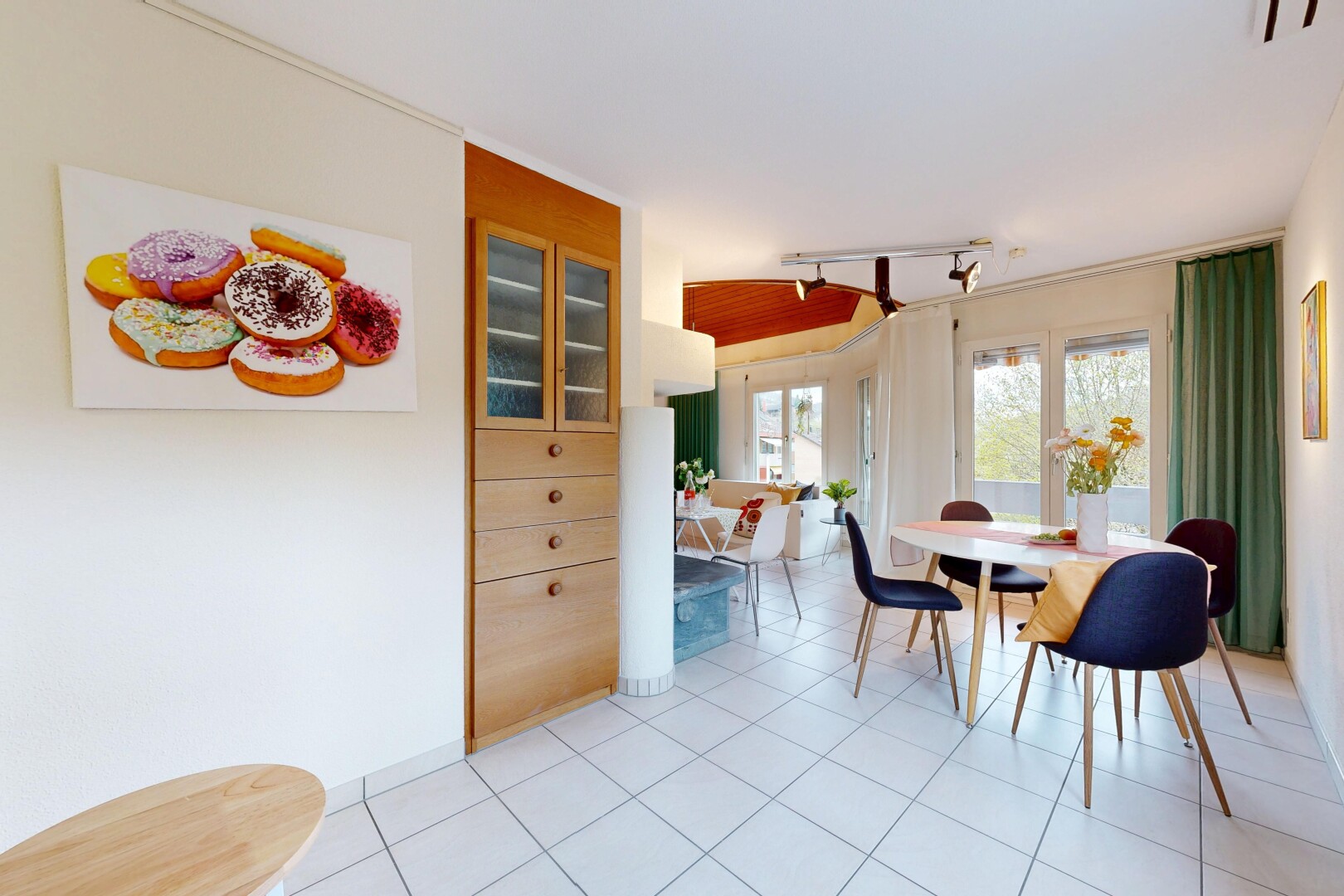 dining space featuring light tile patterned floors and rail lighting