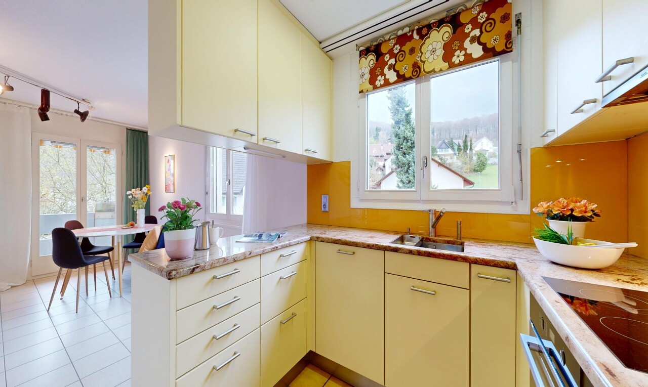 kitchen with a peninsula, wall oven, plenty of natural light, black electric stovetop, and track lighting