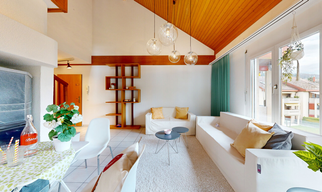 living / dining room featuring a vaulted wooden ceiling