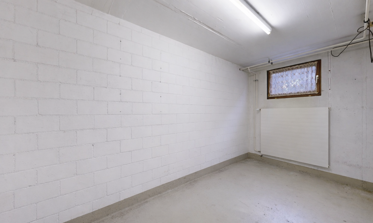 unfurnished room featuring unfinished concrete flooring