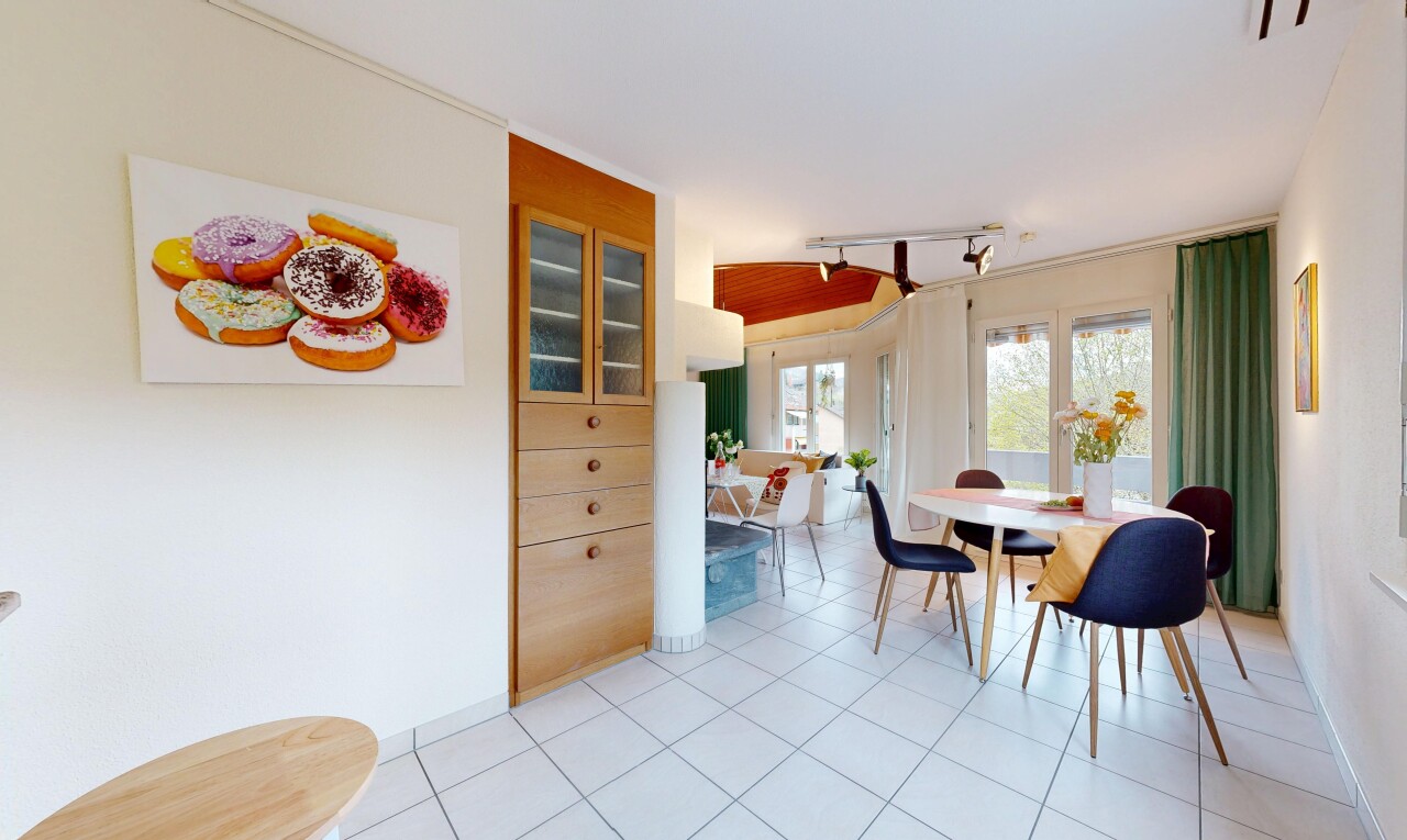 dining space featuring light tile patterned floors and rail lighting