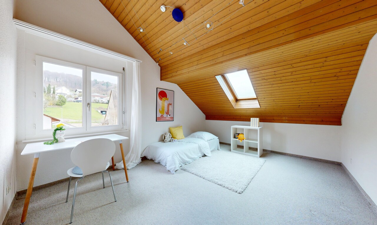 carpeted room featuring a vaulted wooden ceiling and a skylight