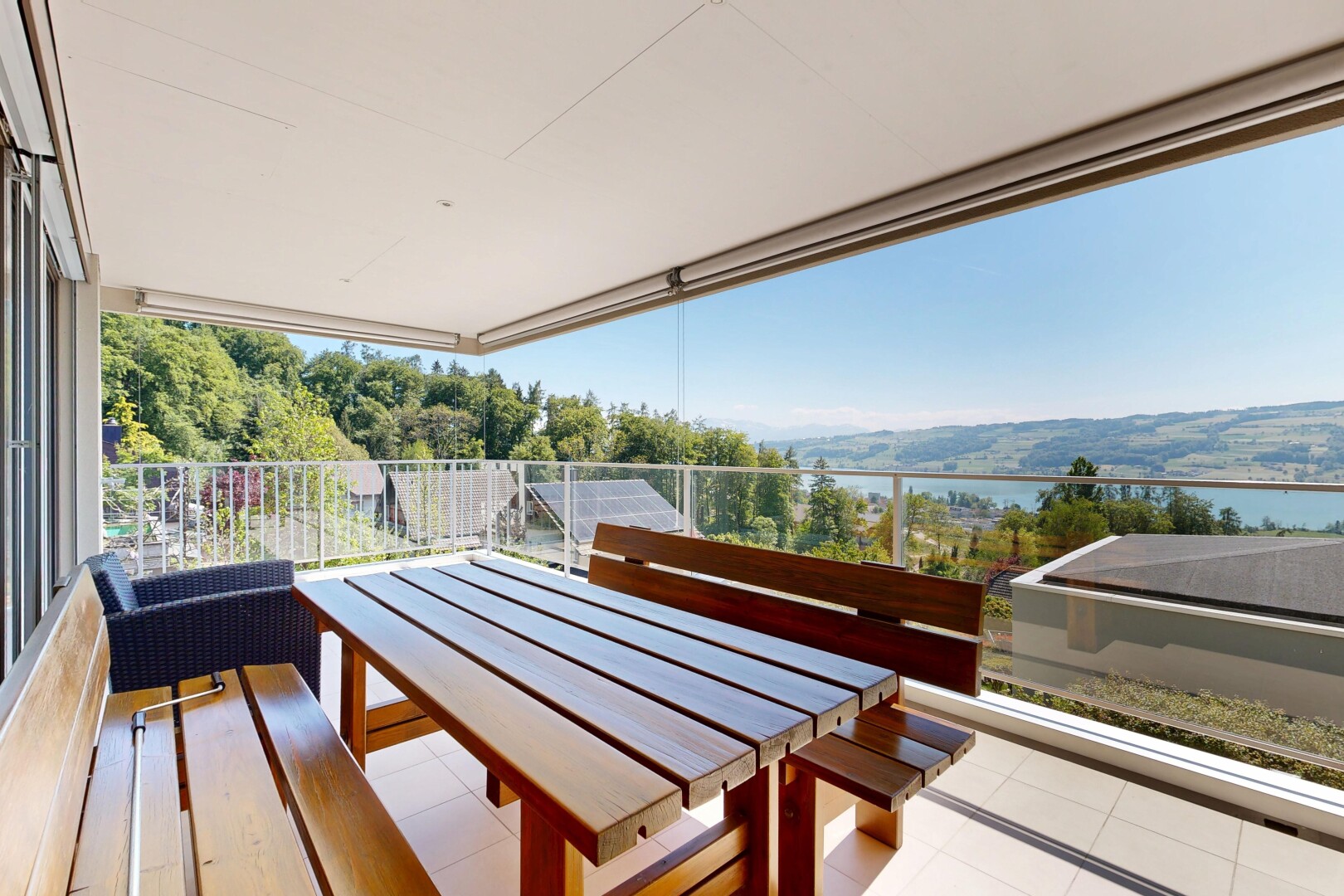 terrace featuring a patio area, outdoor dining area, and a water view