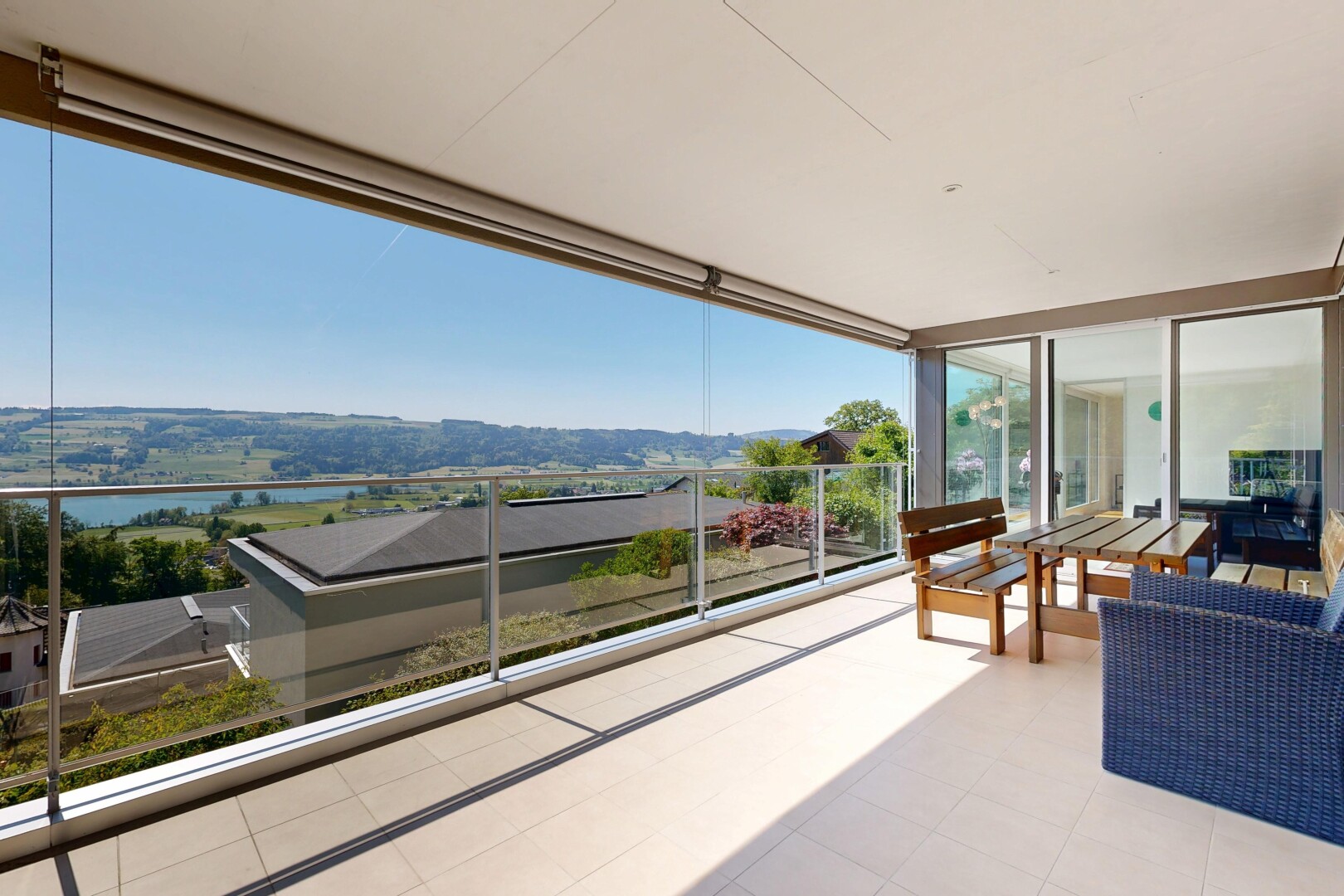terrace with a patio area and a water view