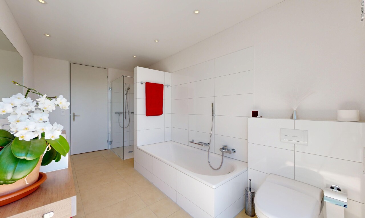 full bathroom featuring a stall shower, a bath, vanity, and recessed lighting