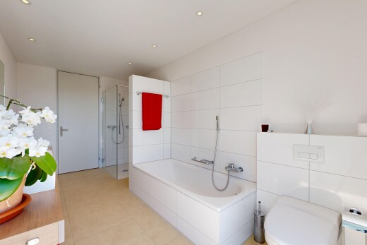 full bathroom featuring a stall shower, a bath, vanity, and recessed lighting