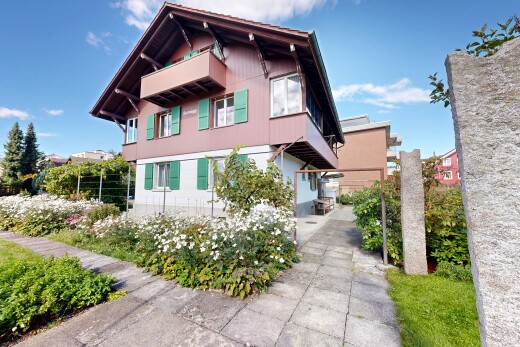 außenansicht mit property visible, vertikale verkleidung, und day time