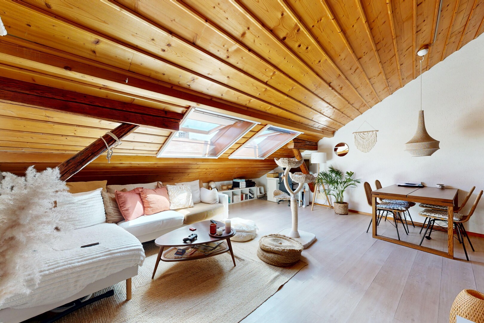living / dining area featuring a vaulted wood ceiling, pendant lighting, and light wood-style floors