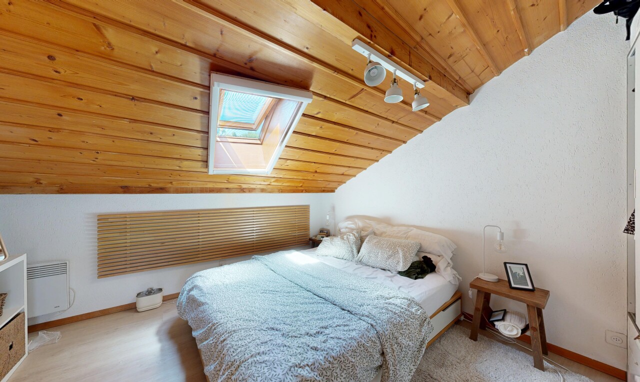 room with wood ceiling, lofted ceiling with skylight, and heating unit