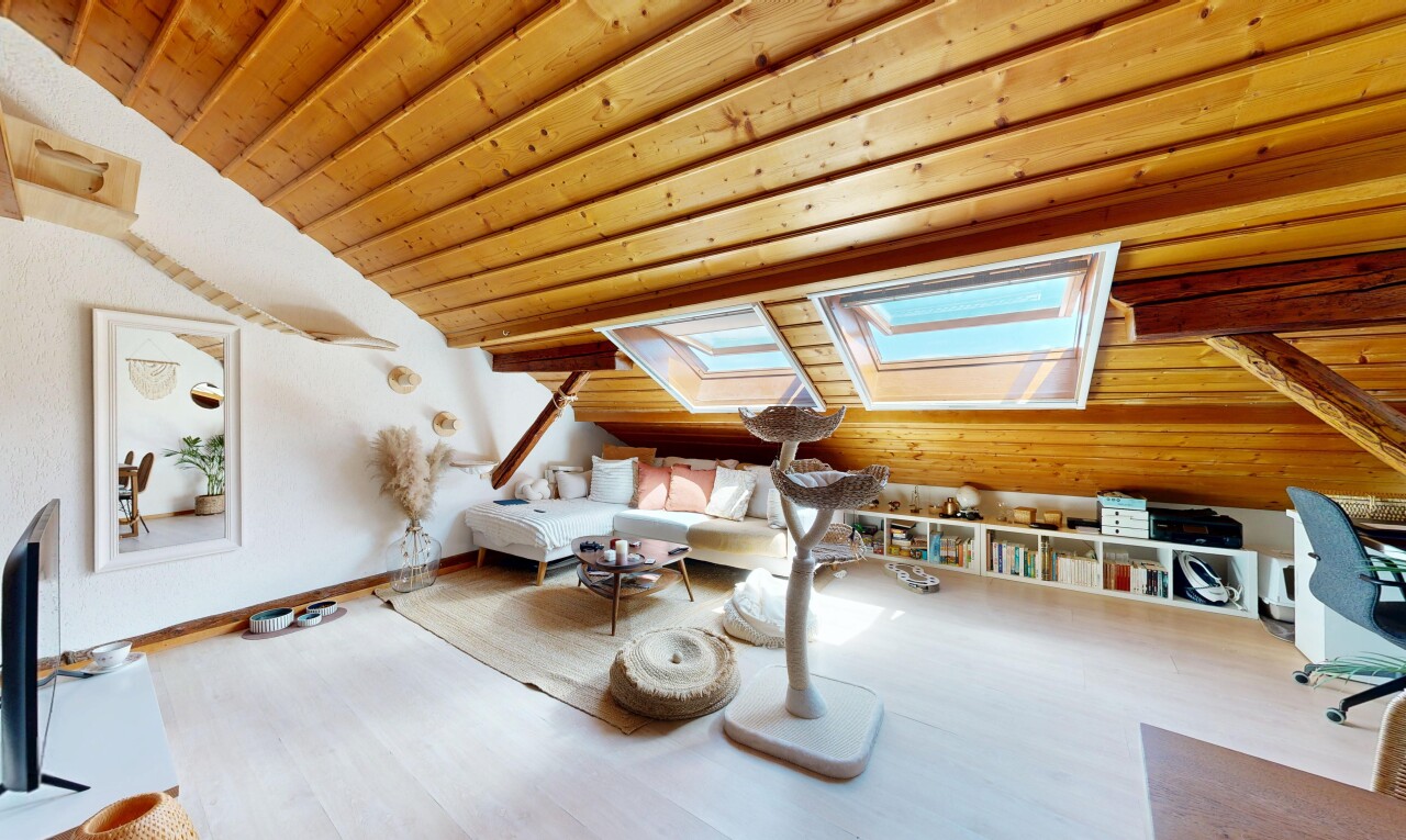 living room with vaulted ceiling with skylight, wood ceiling, and wood finished floors