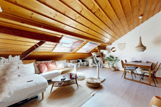 living / dining area featuring a vaulted wood ceiling, pendant lighting, and light wood-style floors