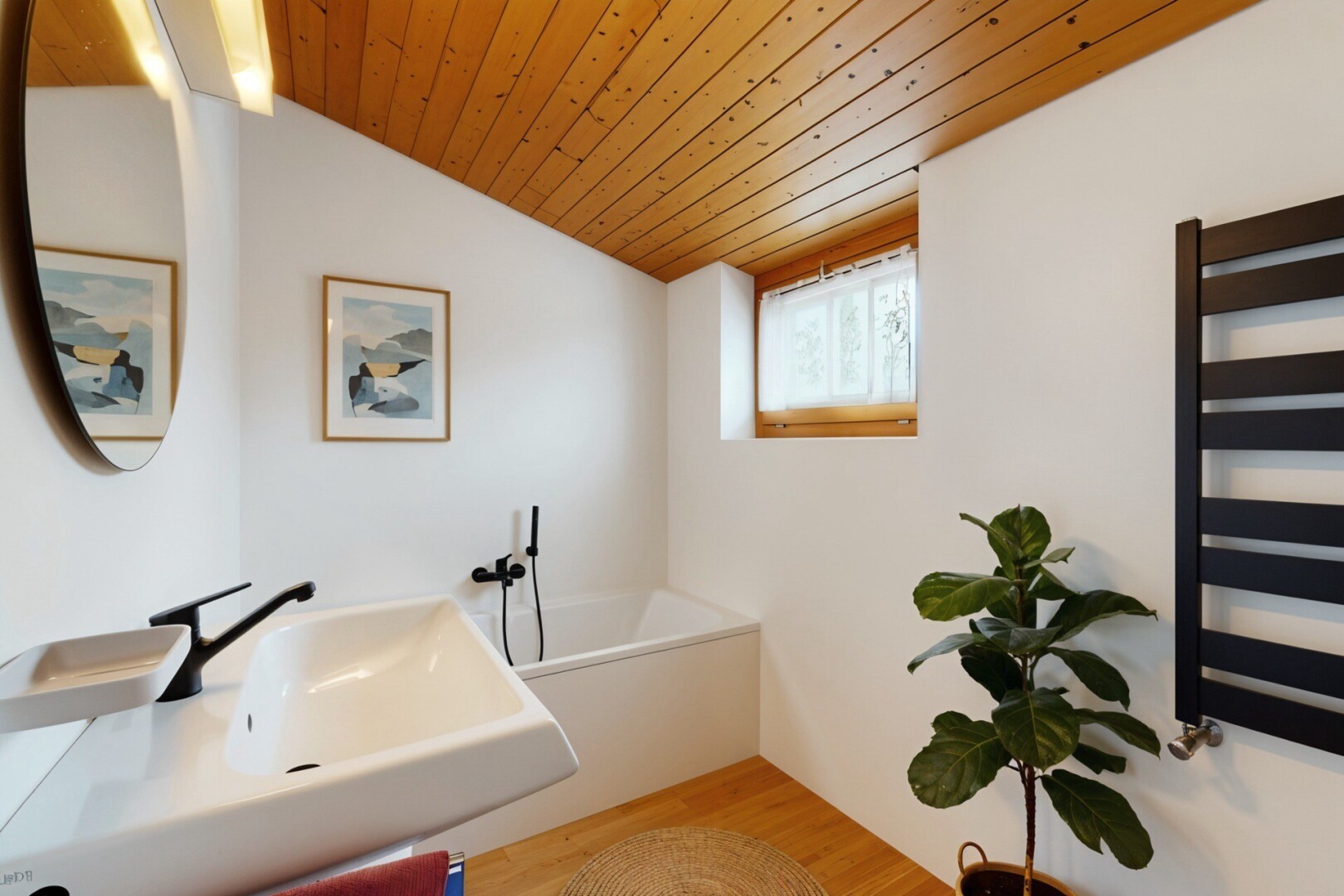 bathroom featuring a vaulted wood ceiling, radiator heating unit, light wood finished floors, a towel warmer, and a bath