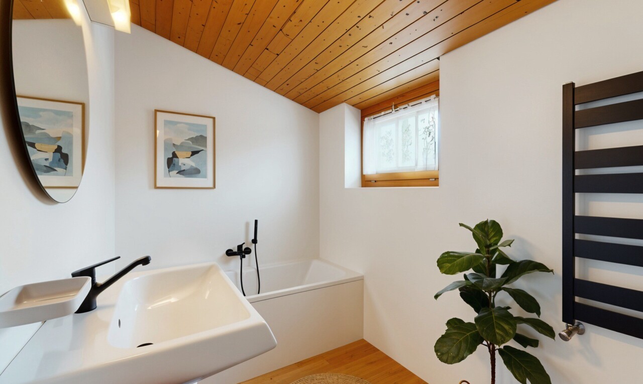 bathroom featuring a vaulted wood ceiling, radiator heating unit, light wood finished floors, a towel warmer, and a bath