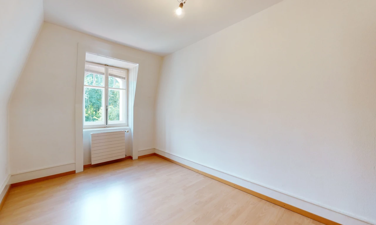 interior space with wood-type flooring, natural light, and radiator