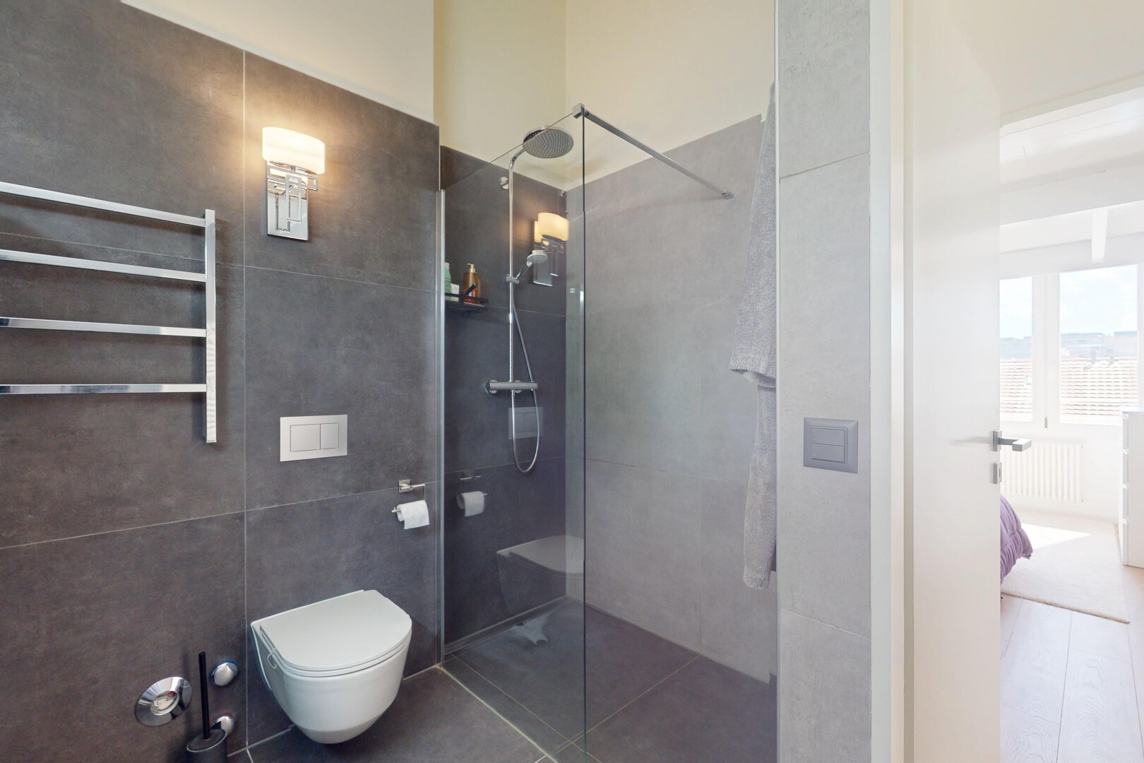 bathroom featuring radiator, walk in shower, and tile patterned flooring