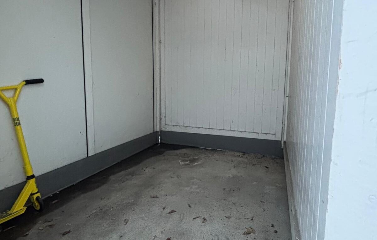 unfurnished room with unfinished concrete floors and a closet