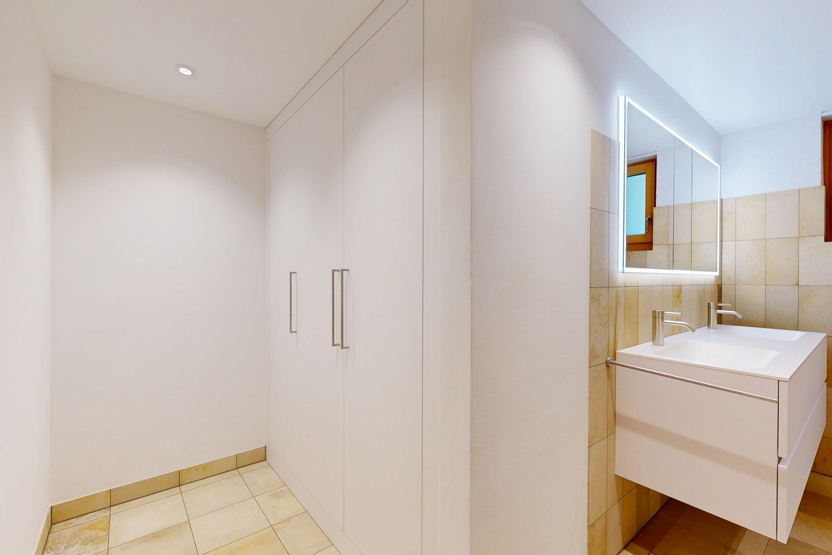 bathroom featuring vanity and tile walls