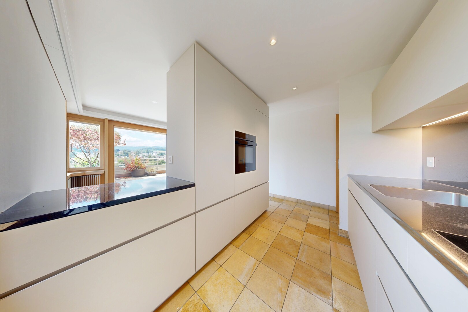 kitchen featuring white cabinetry, modern cabinets, black oven, light tile patterned floors, and recessed lighting