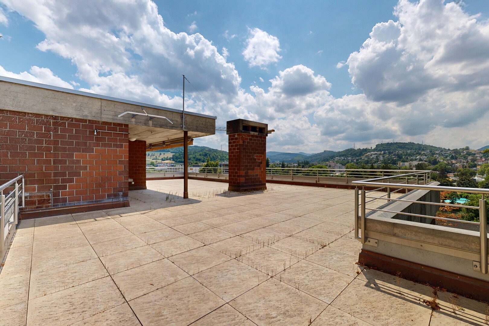 terrace with a patio and a mountain view