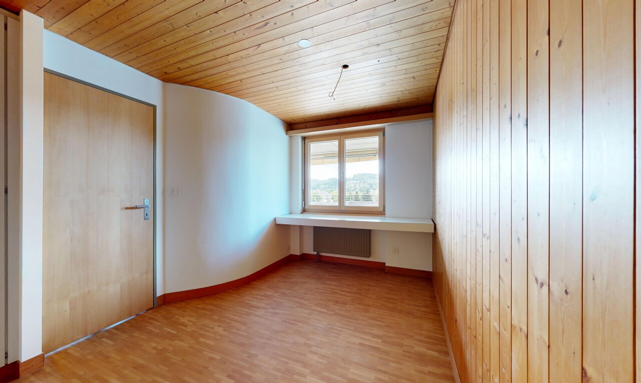 unfurnished room featuring wooden ceiling, wood finished floors, and radiator