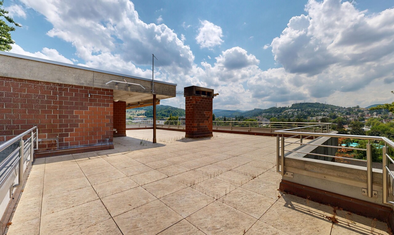 terrace with a patio and a mountain view