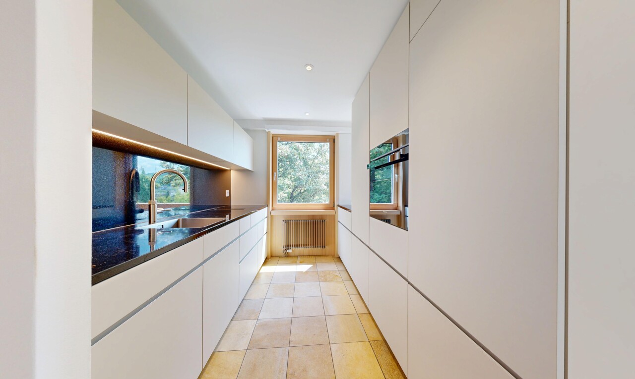 kitchen featuring white cabinets, wall oven, radiator, and recessed lighting