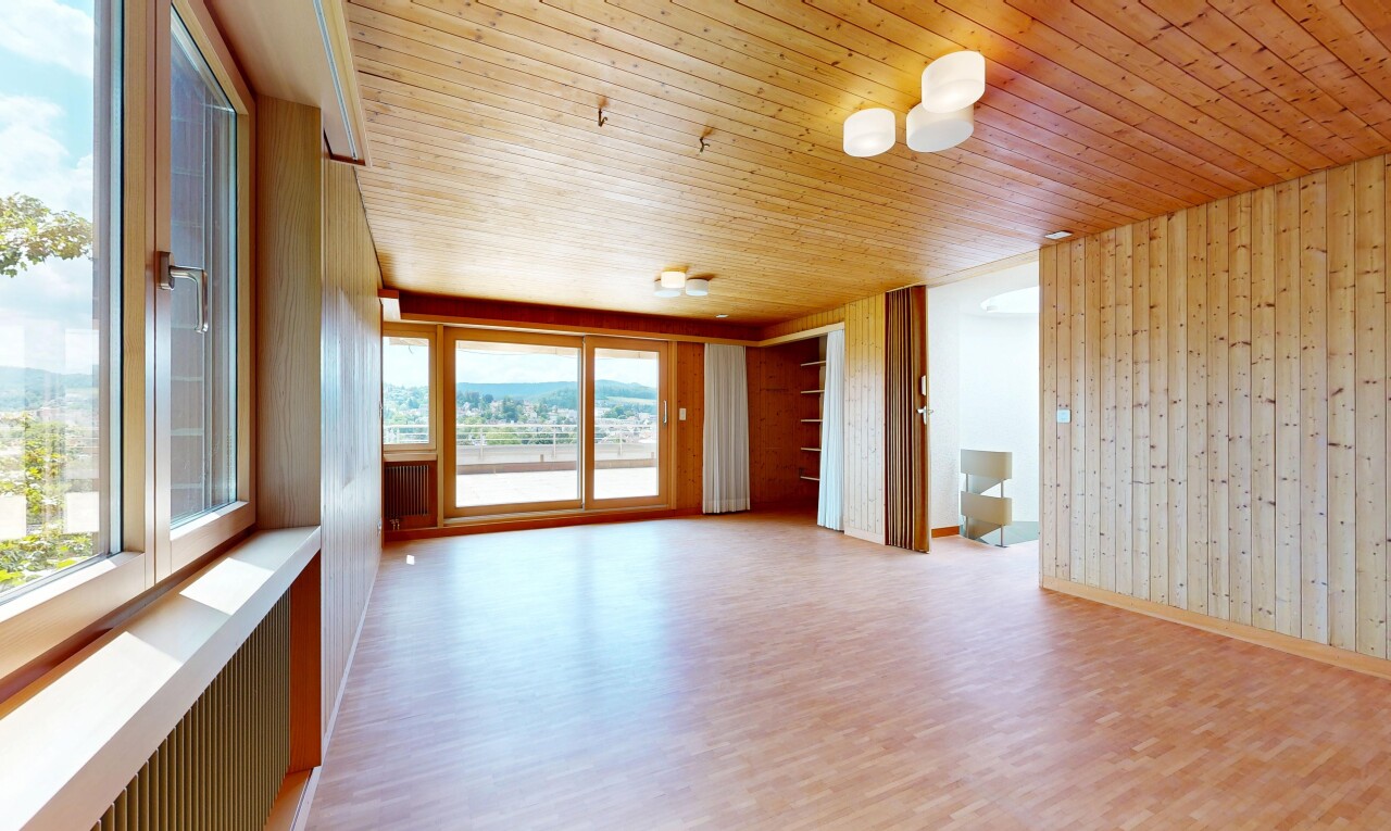 spare room with light wood-type flooring, wooden walls, and wooden ceiling