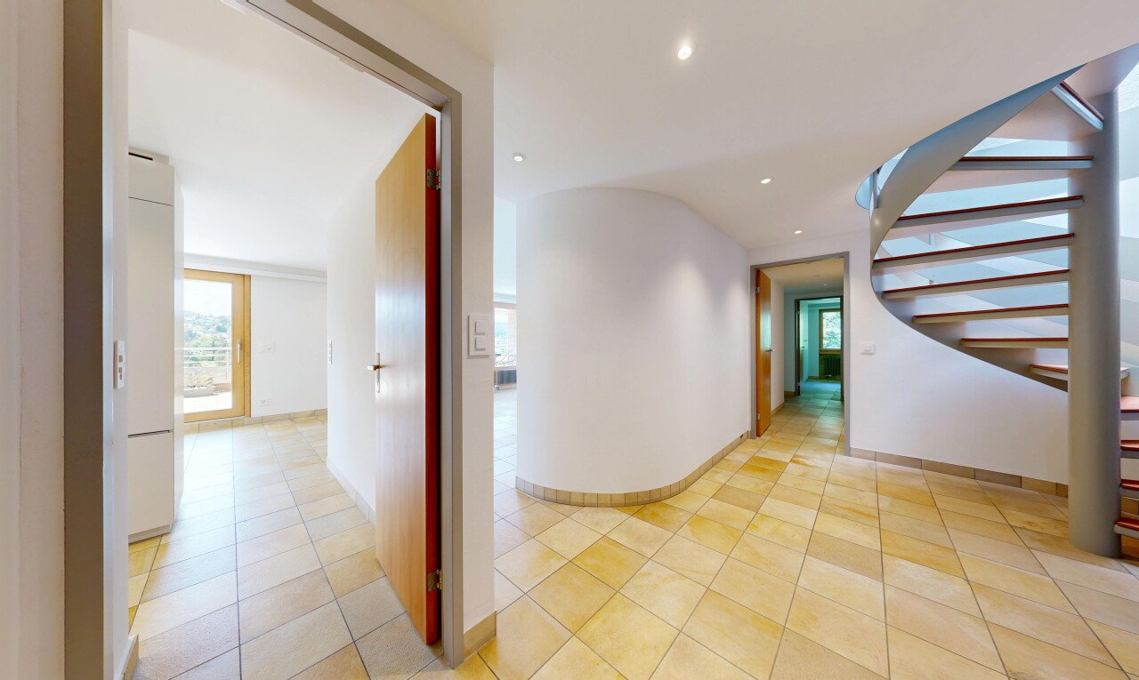 corridor featuring recessed lighting and light tile patterned floors