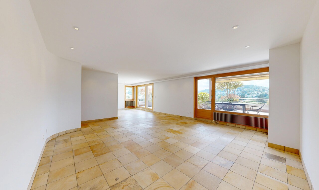 empty room with radiator and baseboards
