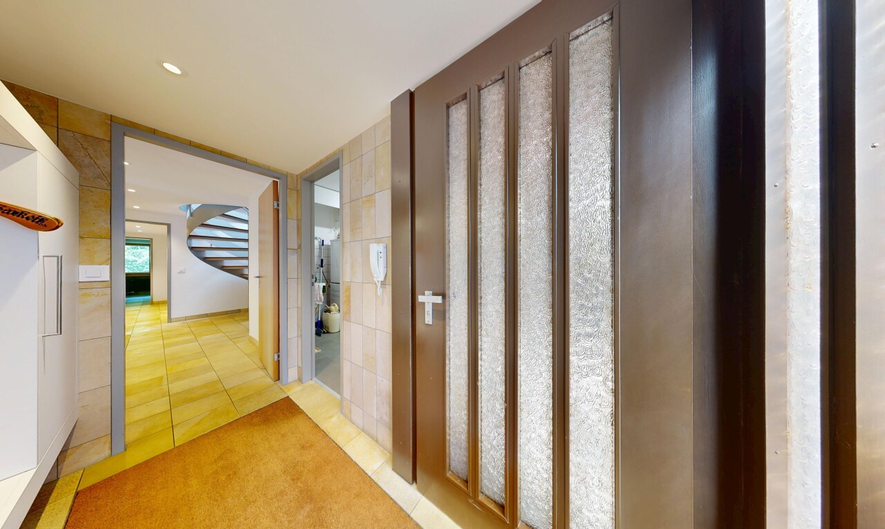 hall featuring light tile patterned floors and recessed lighting