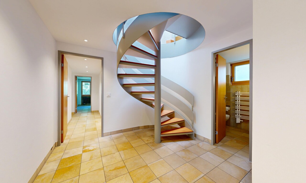 stairs featuring tile patterned flooring and recessed lighting