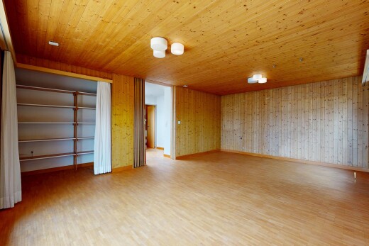 unfurnished room with light wood-style floors, wooden walls, and wood ceiling